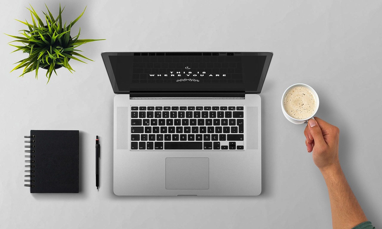 Laptop, coffee, arm — Save Money On Wine Bottles With Wine Cellar And More
