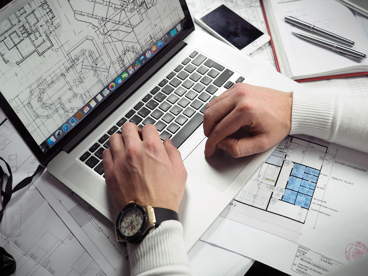 Blueprints, entrepreneur, hands — Sell website: Get The Maximum Return On Your Investment