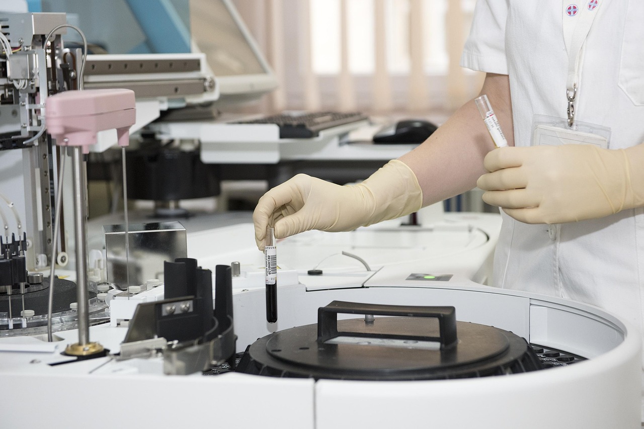 Laboratory, test tubes, healthcare worker — Shape Future Healthcare Innovations With Health Economics Outcomes Research