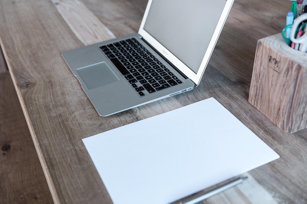 Home office, laptop, notebook — Signs That You Need a Brazilian Butt Lift: Insights from Dr. Peter Driscoll