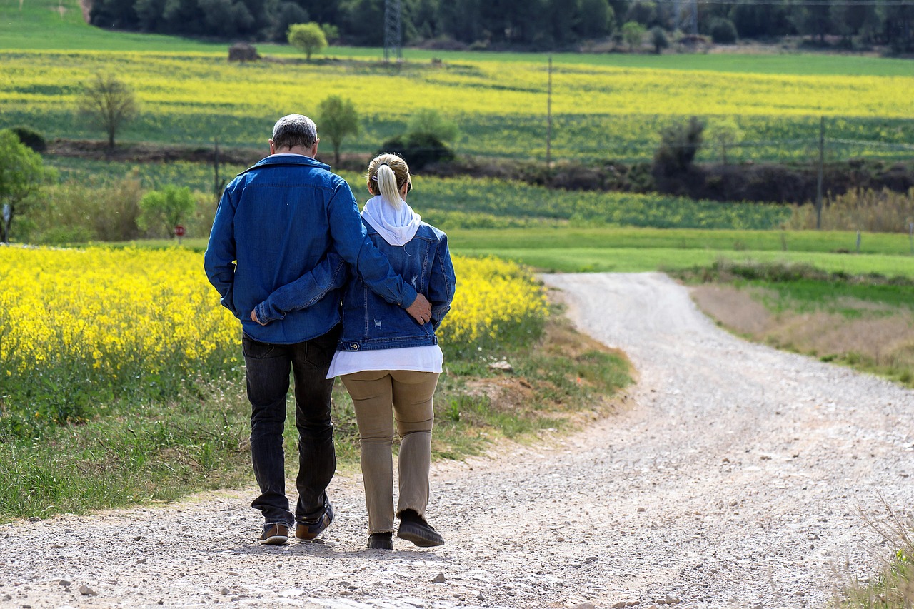 Walk, flower background, couple — Spine surgeon near me providing advanced care for pain relief and improved mobility