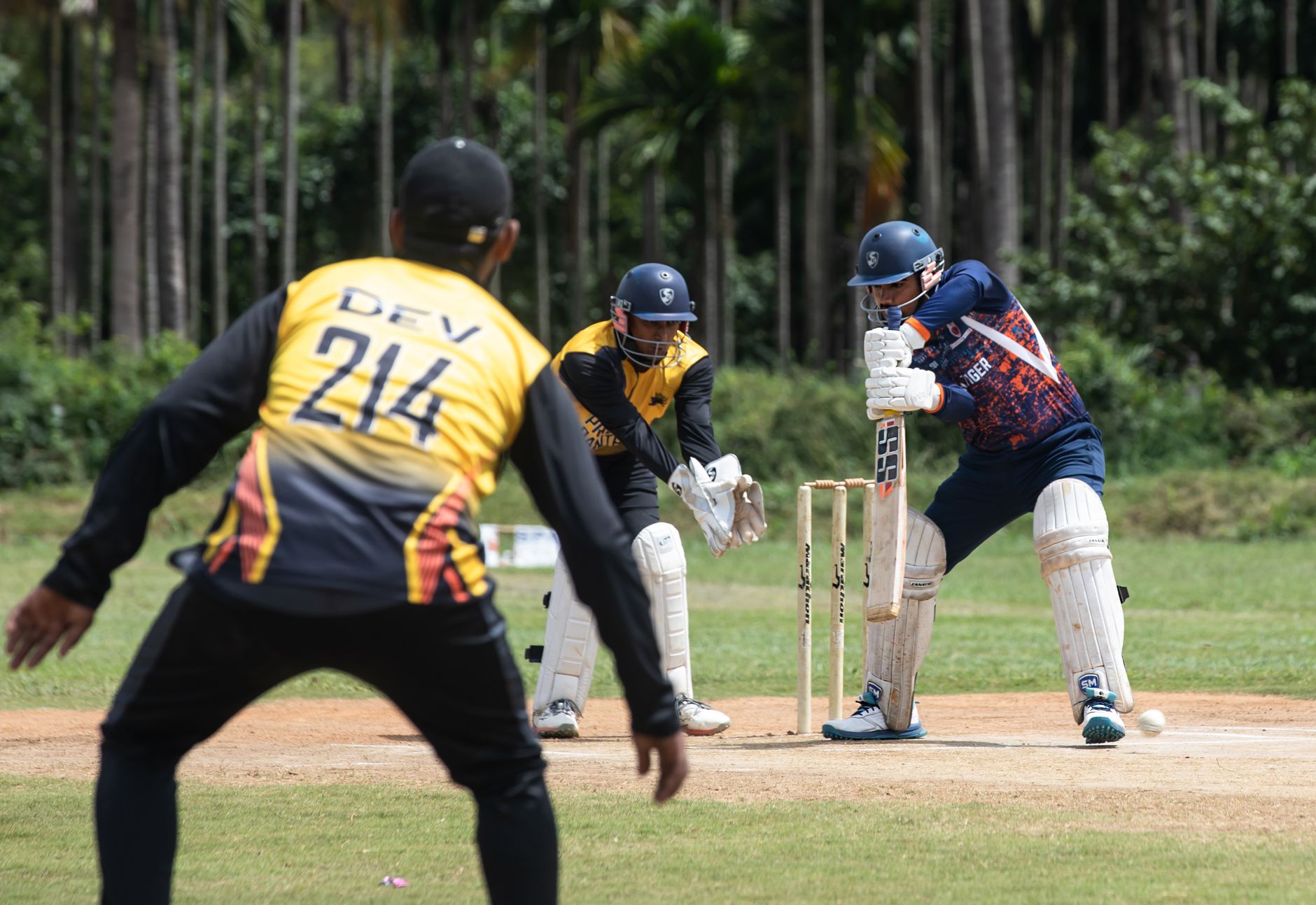 Dynamic cricket match scene with batsman, wicketkeeper, and fielder in action. — VIPTAKA, krikya, Baji Live, KTWIN – Trends D