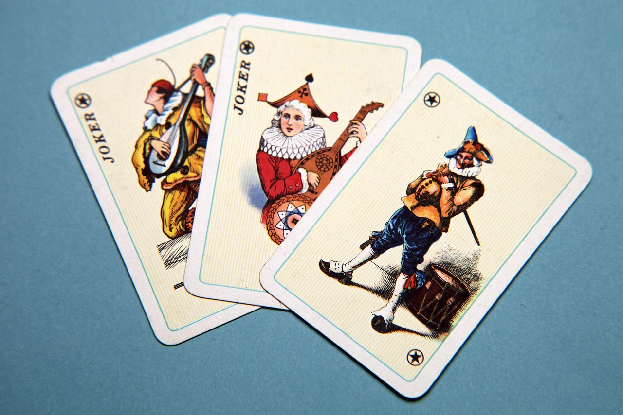 Playing cards, joker, happiness — What Are The Dangers Of Online Football Betting?