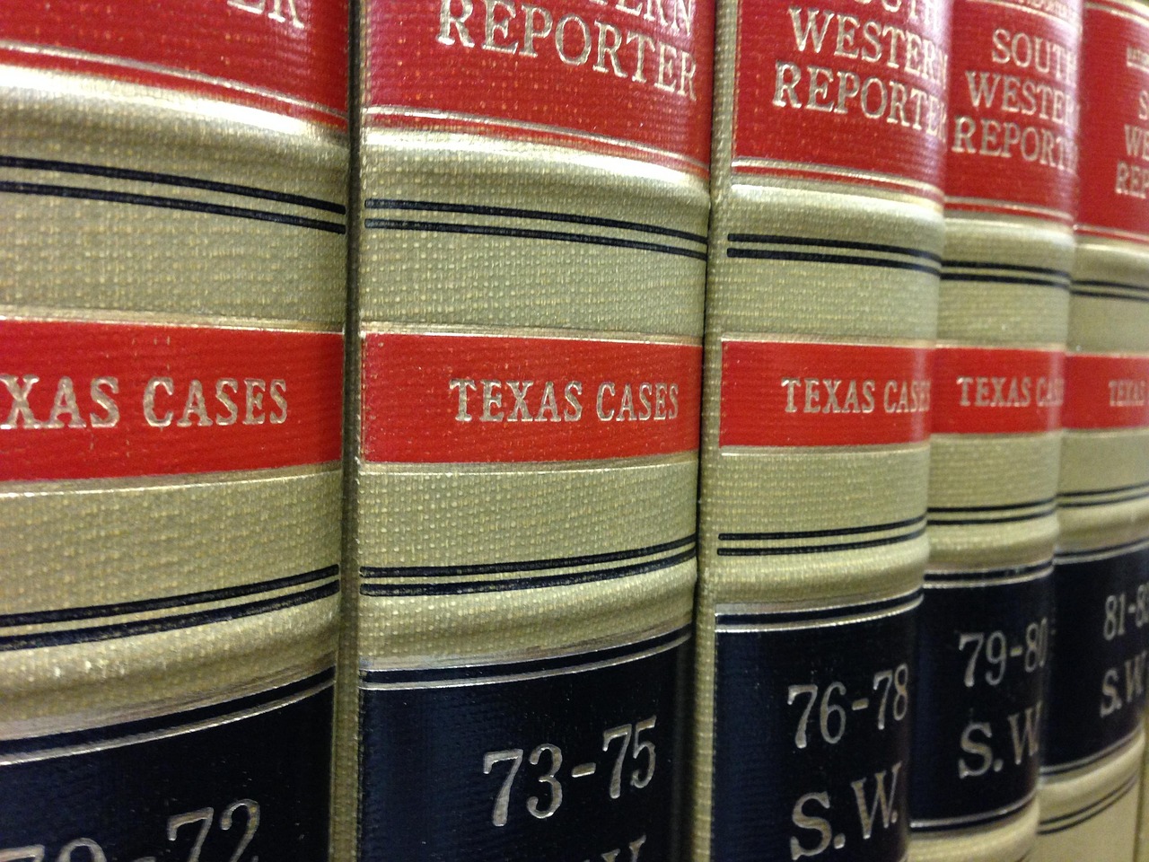 Law books, library, rows of books — Why do you need to hire a divorce attorney?